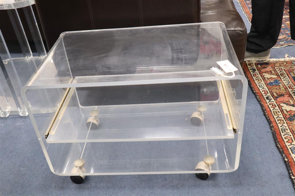 A 1970s lucite wheeled stand, width 65cm x depth 40cm, height 47cm